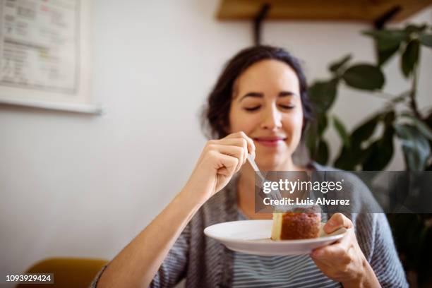 young woman having breakfast at home - eating cake stock pictures, royalty-free photos & images