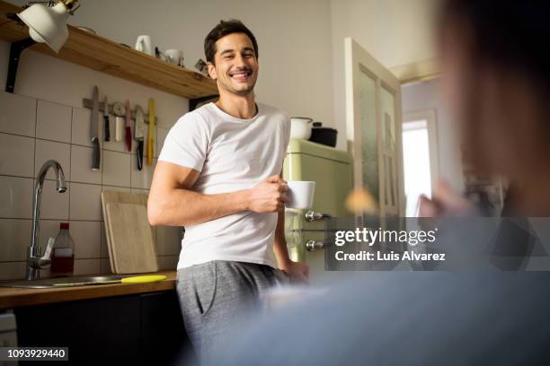 man having coffee at home in morning - man wife kitchen stock pictures, royalty-free photos & images