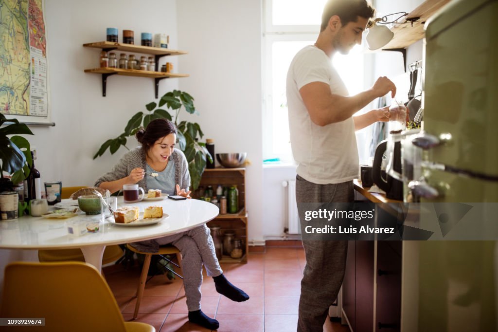 Young couple in kitchen in morning