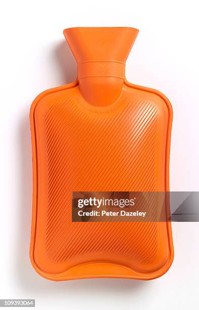 hot water bottle on white background - wärmflasche stock-fotos und bilder