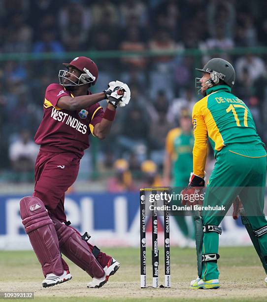 Dwayne Bravo of West Indies hits six during the 2011 ICC World Cup Group B match between West Indies and South Africa at Feroz Shah Kotla Stadium on...