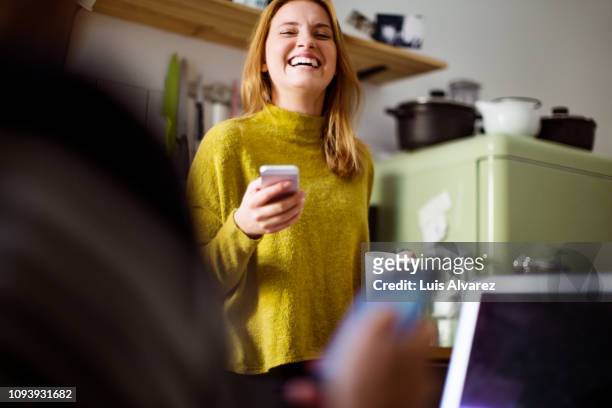 smiling woman at home in morning - differential focus fotografías e imágenes de stock