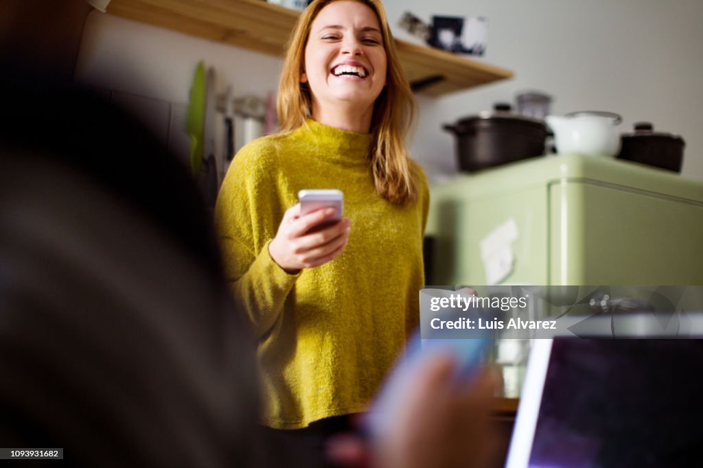 Smiling woman at home in morning