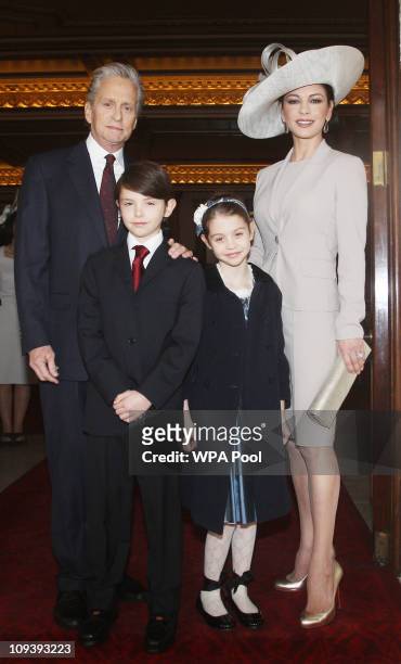 Actress Catherine Zeta Jones arrives with her husband, actor Michael Douglas and their children Dylan and Carys Douglas, to attend a Royal...