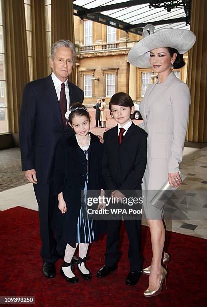 Actress Catherine Zeta-Jones arrives with her husband, actor Michael Douglas and their children Dylan and Carys Douglas, to attend a Royal...