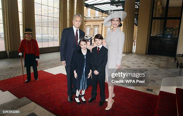 Actress Catherine Zeta-Jones arrives with her husband, actor Michael Douglas and their children Dylan and Carys Douglas, to attend a Royal...