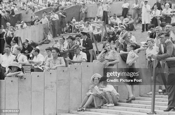 Some of the spectators at Wembley Stadium during the Olympic Games, London, 29th July-14th August 1948. Original Publication: Picture Post - 4582 -...