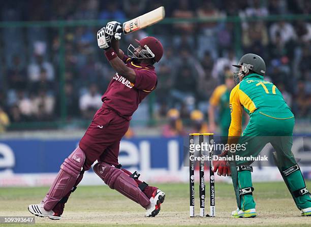 Dwayne Bravo of West Indies hits six during the 2011 ICC World Cup Group B match between West Indies and South Africa at Feroz Shah Kotla Stadium on...