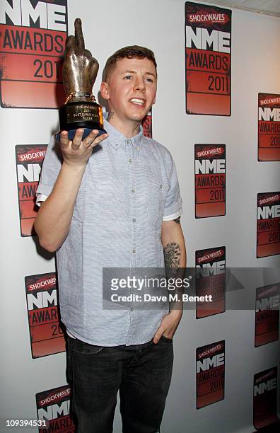 Professor Green poses with the "Best Dancefloor Filler" award in front of the winners boards at the Shockwaves NME Awards 2011 held at the Brixton...