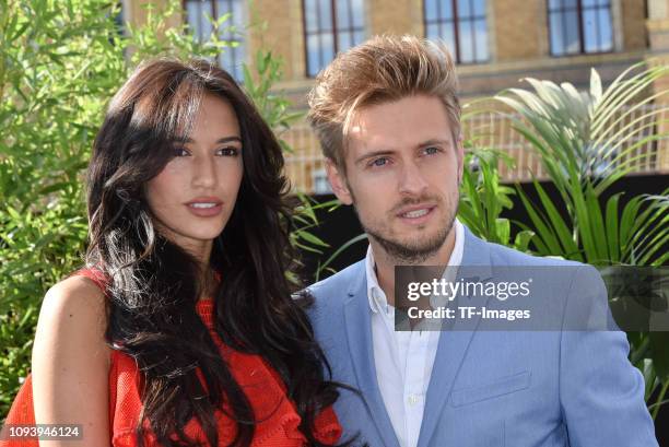 Joern Schloenvoigt and Hanna Weig attend the Guido Maria Kretschmer show during the Guido Maria Kretschmer show during the Berlin Fashion Week...