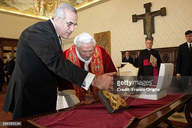 Pope Benedict XVI exchanges gifts with the President of Lebanon Michel Sleiman during a meeting at his private library on February 24, 2011 in...