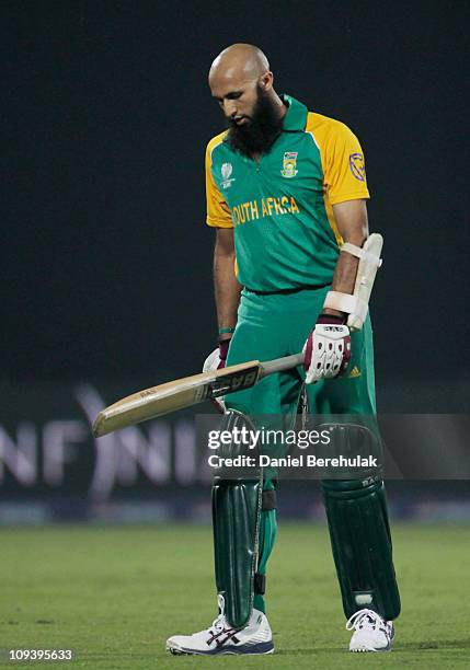 Hashim Amla of South Africa walks back to the pavillion after being dismissed by Kemar Roach of West Indies during the 2011 ICC World Cup Group B...