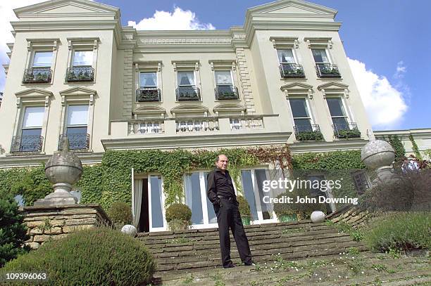 Russian oligarch and businessman Boris Berezovsky outside his house in Egham, Surrey, where he lives in exile, 24th August 2002