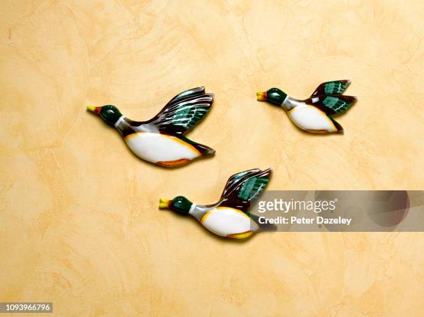 kitsch retro flying duck ornaments - duck bird stock pictures, royalty-free photos & images