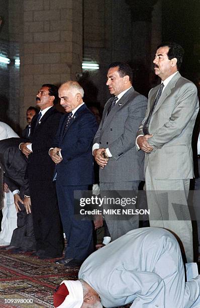 Iraqi President Saddam Hussein, Egyptian President Hosni Mubarak, Jordanian King Hussein and North Yemeni President Ali Abdullah Saleh attend the...