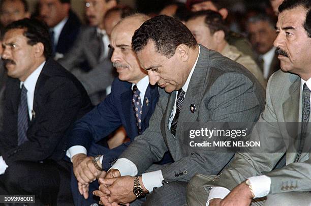 Iraqi President Saddam Hussein, Egyptian President Hosni Mubarak, Jordanian King Hussein and North Yemeni President Ali Abdullah Saleh attend the...