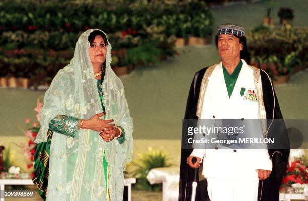 Muammar Gaddafi welcomes delegations arriving for the african unity organization with his wife Safia.