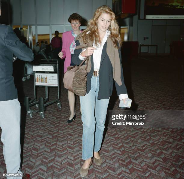 Cindy Crawford at London Heathrow Airport. Cindy is with her husband, actor, Richard Gere. He is out of shot, but in another frame in this set. The...