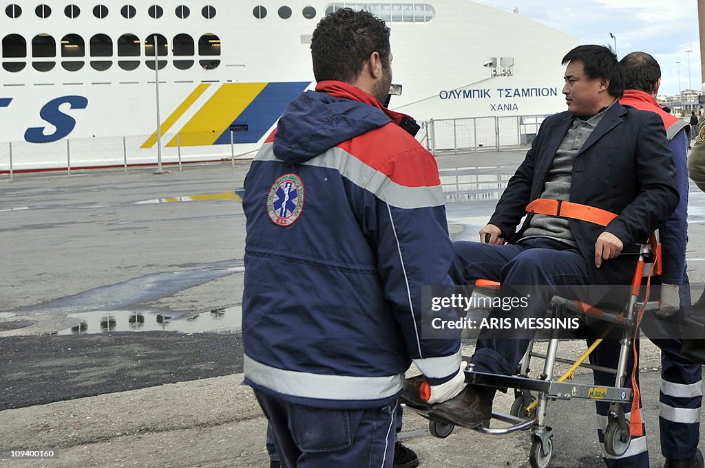 A Chinese evacuee from Libya is carried
