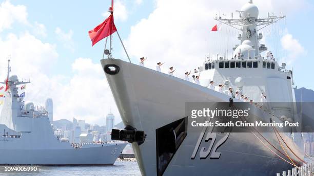 Chinese navy Type 052C Luyang II class destroyer "Jinan" and Type 052D Luyang III class destroyer "Yinchuan" prepare to leave the Victoria Harbour....