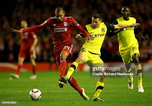 Libor Sionko of Sparta Prague challenges David Ngog of Liverpool during the UEFA Europa League Round of 32 2nd leg match beteween Liverpool and...