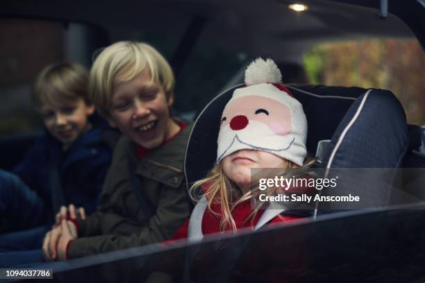 children in the car going christmas shopping - christmas fun stock pictures, royalty-free photos & images