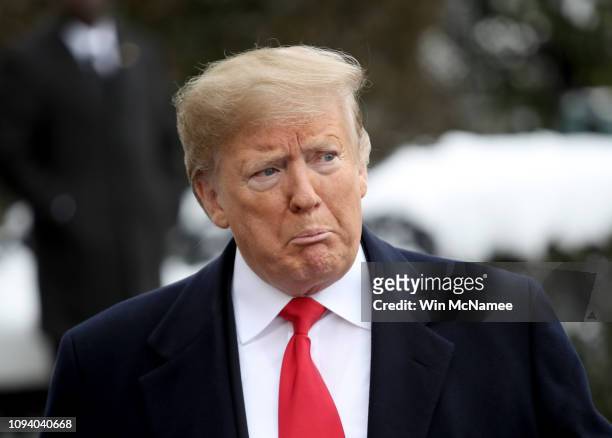 President Donald Trump answers questions from the press as he departs the White House January 14, 2019 in Washington, DC. Trump is scheduled to...