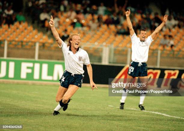 Mark Wright of England celebrates after scoring during the 1990 FIFA World Cup Group F match between England and Egypt at the Stadio Sant'Elia on...