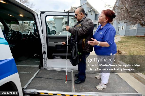 Paratransit driver Dar Owsianny helps Jesse Soto, of Longmont, into a VIA Mobility Services vehicle, Thursday, March. 6, 2014. Soto uses the service...