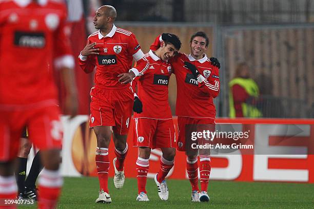 Eduardo Salvio of Benfica celebrates his team's first goal with team mates Nicolas Gaitan and Luisao during the UEFA Europa League match round of 32...