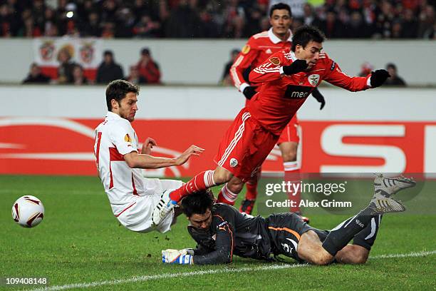 Goalkeeper Marc Ziegler of Stuttgart is hit by Nicolas Gaitan of Benfica during the UEFA Europa League match round of 32 second leg between VfB...