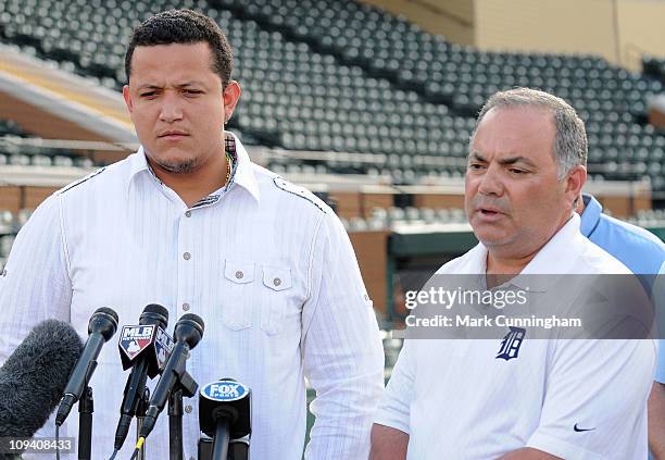 Miguel Cabrera of the Detroit Tigers looks on as Tigers Vice President and Assistant General Manager Al Avila speaks to the media during a press...