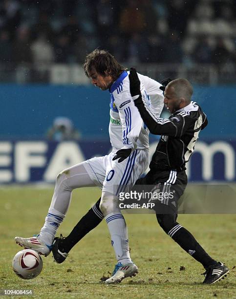 Artem Milevskiy of Dynamo Kiev fights for a ball against Mehmet Aurelio of Besiktas of Turkey during the UEFA Europa League football match in Kiev on...
