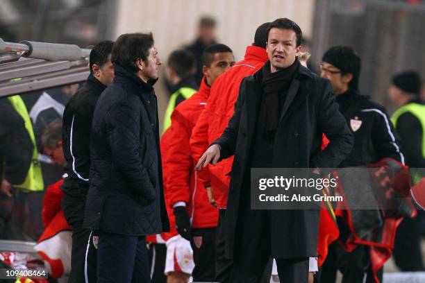 Head coach Bruno Labbadia and manager Fredi Bobic of Stuttgart react after the UEFA Europa League match round of 32 second leg between VfB Stuttgart...