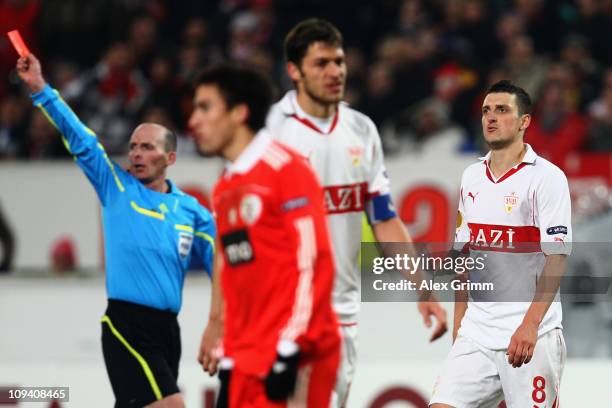 Zdravko Kuzmanovic of Stuttgart is sent off by referee Michael Leslie Dean during the UEFA Europa League match round of 32 second leg between VfB...