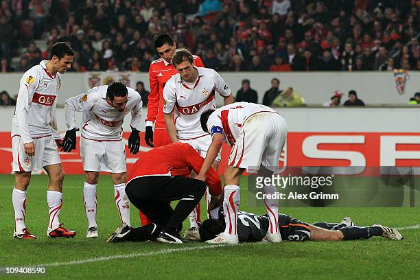 Goalkeeper Marc Ziegler of Stuttgart receives treatment during the UEFA Europa League match round of 32 second leg between VfB Stuttgart and Benfica...