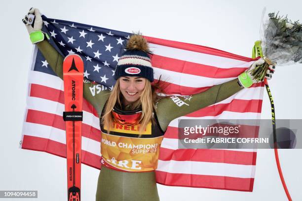 Gold medallist US Mikaela Shiffrin poses with her national flag during the flower ceremony of the women's Super G event of the 2019 FIS Alpine Ski...