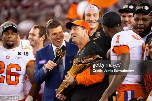 Head Coach Dabo Swinney of the Clemson Tigers celebrates with his team after defeating the Alabama Crimson Tide during the College Football Playoff...