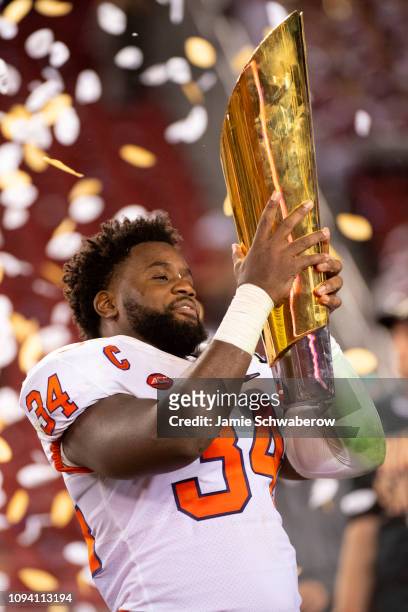 Kendall Joseph of the Clemson Tigers hold the trophy after defeating the Alabama Crimson Tide during the College Football Playoff National...