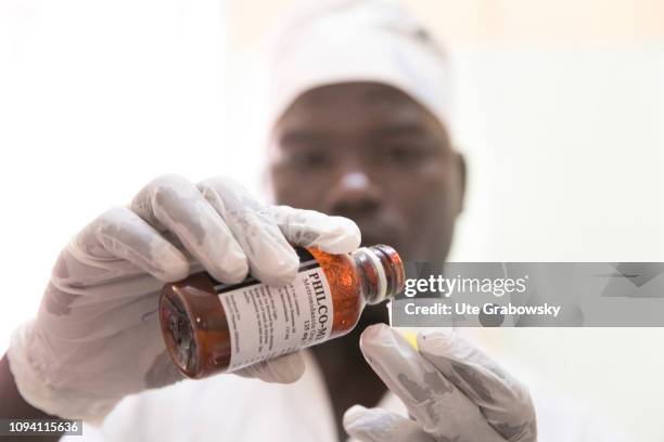 Djamena, Chad Doctors and nurses during a round in a patient's room preparing a antibiotic on August 29, 2018 in N´Djamena, Chad.