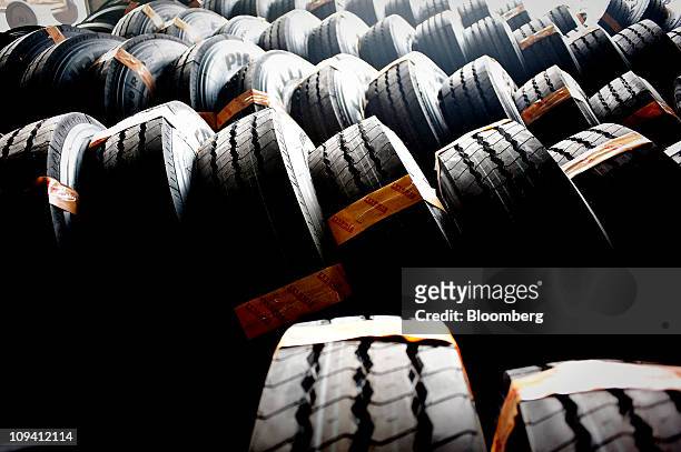 Tires sit in a warehouse at the Pirelli & C SpA tire factory in Jining, Shandong Province, China on Thursday, Feb. 24, 2011. Pirelli & C SpA,...