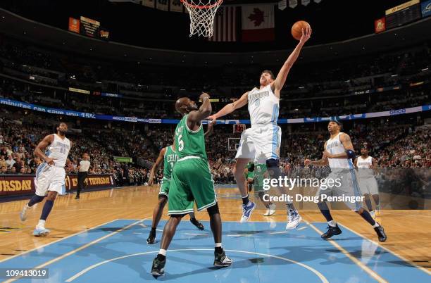 Danilo Gallinari of the Denver Nuggets lays up a shot against Kevin Garnett of the Boston Celtics during NBA action at the Pepsi Center on February...