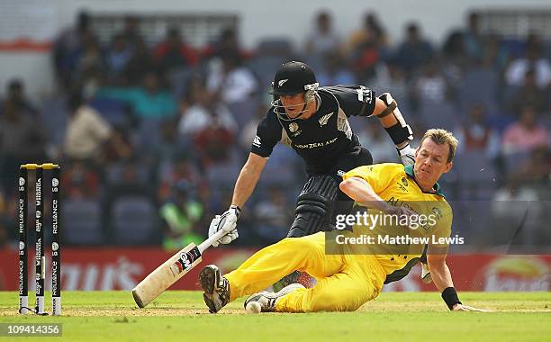 Brett Lee of Australia looks to run out Brendon McCullum of New Zealand during the 2011 ICC World Cup Group A match between Australia and New Zealand...