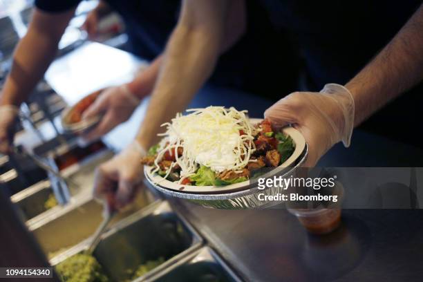An employee prepares a burrito bowl at a Chipotle Mexican Grill Inc. Restaurant in Louisville, Kentucky, U.S., on Saturday, Feb. 2, 2019. Chipotle...