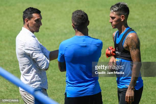 Kevin Mac Allister talks to Nicolas Burdisso Sport Director of Boca Juniors after a training session at Complejo Pedro Pompilio on February 5, 2019...