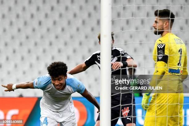 Marseille's French defender Boubacar Kamara celebrates after scoring a goal next to Bordeaux's French goalkeeper Benoit Costil during the French L1...