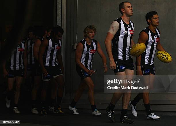 Nick Maxwell captain of the Magpies leads his team out for the start of the NAB Cup Quarter Final match between the Collingwood Magpies and the...