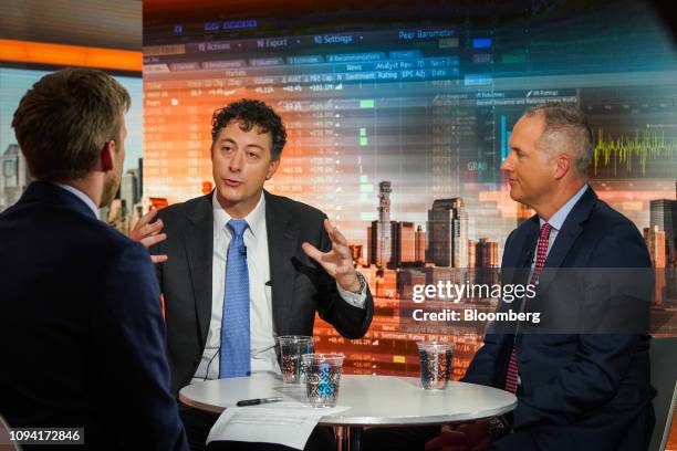 Jeff Smith, chief executive officer of Starboard Value LP, left, speaks while Steve Ritchie, chief executive officer of Papa John's International,...