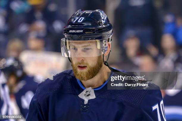 Joe Morrow of the Winnipeg Jets looks on during the pre-game warm up prior to NHL action against the San Jose Sharks at the Bell MTS Place on...