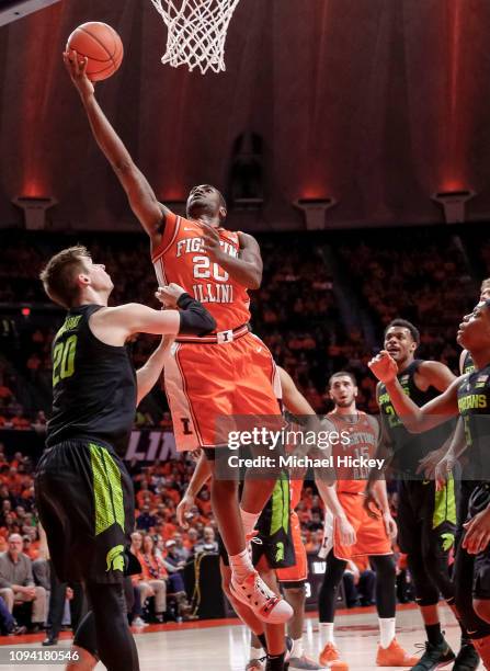 Da'Monte Williams of the Illinois Fighting Illini shoots the ball over Matt McQuaid of the Michigan State Spartans during the first half of the game...